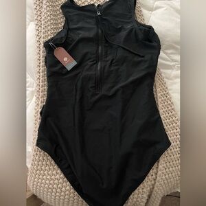 Swismivo brand modest black one piece with zipper front. Very nice quality NWT
